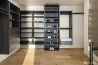 Custom storage – Expansive walk-in closet with sleek modern built-ins.
