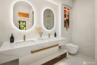 Modern elegance – Floating vanity with designer lighting and fixtures.