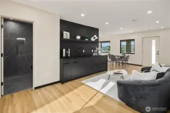 Versatile living – A spacious rec room with sleek built-ins and a modern kitchenette.