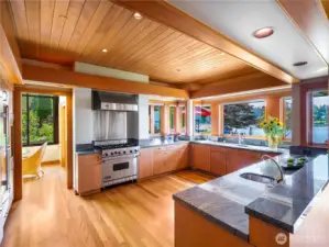 The expansive chef's kitchen combines function and beauty overlooking the terrace and breathtaking scenery