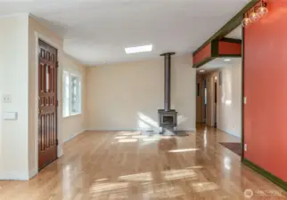 View past the front door and down the hall to the bedrooms.