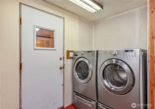 Laundry/utility room with door to covered breezeway.