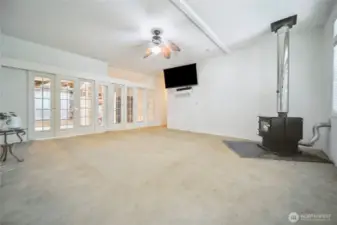 Living room with newer wood burning stove to keep you warmon those cold winter nights.
