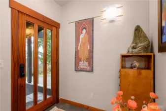 Symbolic of a tataki, a place to slip off your shoes, and greet guests with mindfully designed light fixtures for ambience at your very entrance.