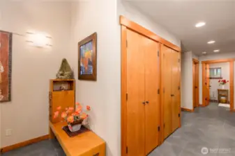 A glimpse into the gallery hallway, with ample storage, a utility closet and flow into the guest quarters.
