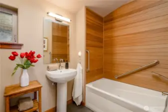 The guest bath, complete with a jetted tub and shower wand gives you a sense of refinement, tranquility and a sense of unity with nature. This is a place of strength and harmony with impeccable balance with a tone of real philosophy that purifies the body and thoughts.