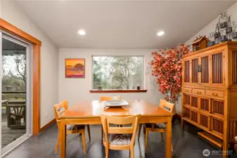 The dining area is incorporated near the kitchen for meaningful space to socialize and gather, an extension of the kitchen.