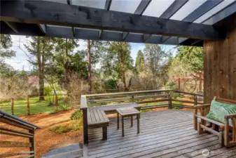 The front sun deck provides an inviting outdoor extension of the home, thoughtfully designed to capture sunlight and create a comfortable place to unwind throughout the day.