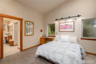 The primary suite is a retreat designed with comfort in mind, offering beautiful light, privacy, and easy access to the executive bath and rear veranda.