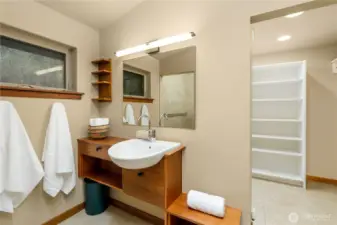 This view highlights the executive bathroom vanity, where soft lighting and refined finishes create a serene space for daily rituals, blending function with a spa-inspired sense of comfort.