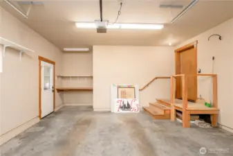 The garage/workshop is a well-organized space with clean lines and ample storage, offering room for tools, projects, and thoughtful organization.