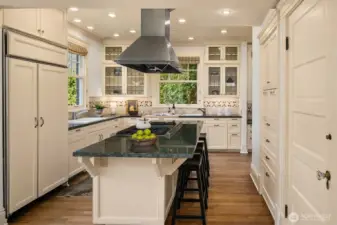 Lovely updated kitchen with a wealth of storage and eating island.