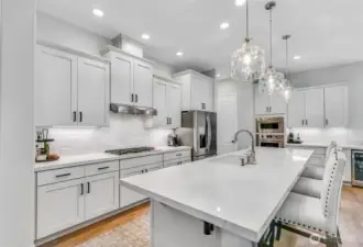 In 2024 the quartz counters, tile backsplash and beverage fridge were added. Enjoy under cabinet lighting and pull-out shelves.