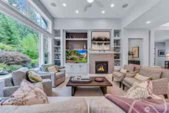 What a gathering place to watch a game or a movie while still enjoy the beauty of the backyard.