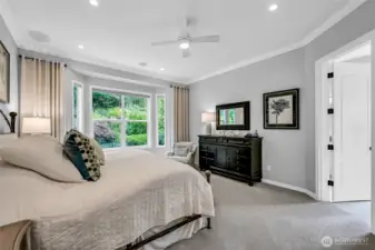 Enjoy the backyard views from the primary bedroom. The two walk-in closets have custom, Container Store, high end organizers.