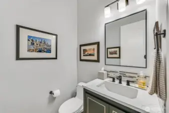 The powder room was also remodeled in 2022 with a new vanity, Kohler undermount sink and faucet, light fixture and a Toto toilet.