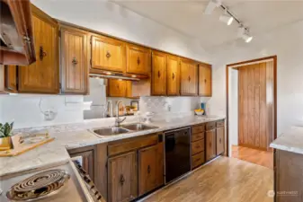 View of kitchen back to entry.