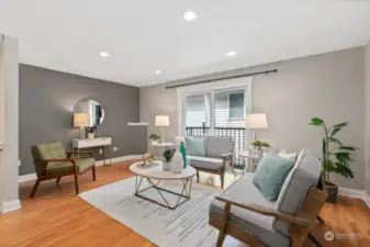 Tired of long skinny floorplans? This spacious townhome is wider, which provides so many more layout options. This is the living room on the middle/main level.