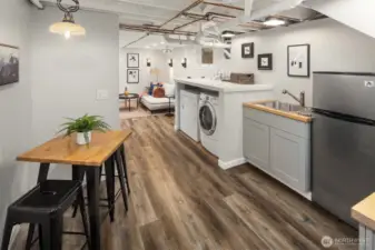 The basement has a kitchenette and is a great hang out space. Not shown is a large unfinished room that could be finished or used as storage!