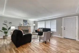 Inside you will find refinished hardwoods and fresh interior paint.  Here is a look at the living room with wood burning fireplace.