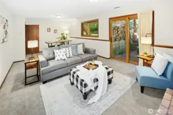 Another angle of the bonus room featuring a charming wood stove fireplace