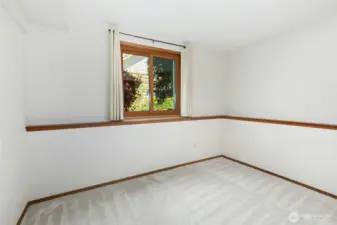 Fifth bedroom located on the lower level, perfect for guests or extended family