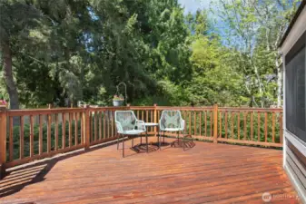 Expansive west-facing deck offering the ideal space to entertain, unwind, and host unforgettable summer barbecues