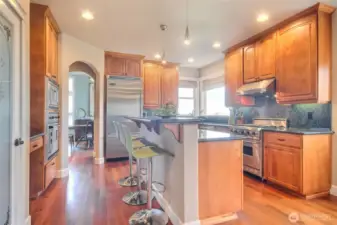 Gourmet kitchen with breakfast bar and double oven.
