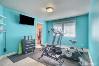 Bedroom #3 of 4 bedrooms is being used as a great workout room.
