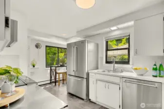 This cheery kitchen has stainless steel appliances and a double oven.