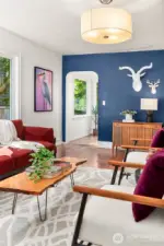 Living room overhead light and arched doorway to kitchen