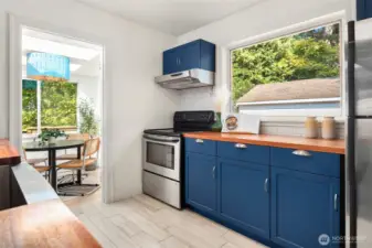 Kitchen with wide window and view to dining room