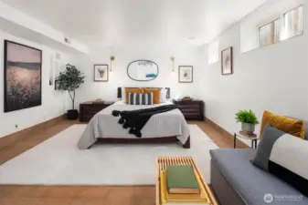 bedroom with tile floor, wide windows and recessed lighting