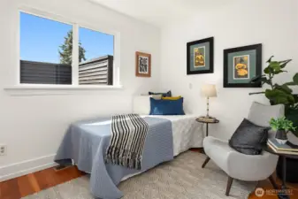 Bedroom with window and hardwood floor