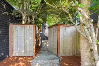 Side-yard fence and gate with garden trees