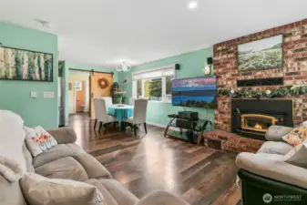 Living room with wood burning fireplace (with fan).
