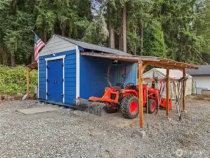 12x16' shed with two awnings for equipment storage.  Has electricity.