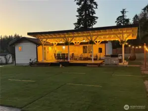 40x16 covered deck with hot tub, fans, lighting and an area for grilling. Deck built with Trex flooring and backyard designed for entertainment!