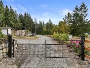 Gated entry to the driveway allows sense of comfort and protection.