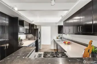 Functional kitchen with abundant storage, eat-in dining area, and easy flow into the formal dining space—ideal for everyday living and hosting.