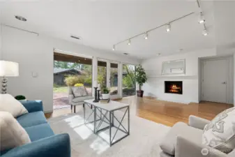 Walk-out lower level featuring a second fireplace, large windows, and versatile living space