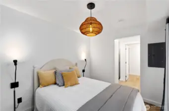 Comfortable ADU bedroom with walk-in closet, providing privacy and independence from the main home.