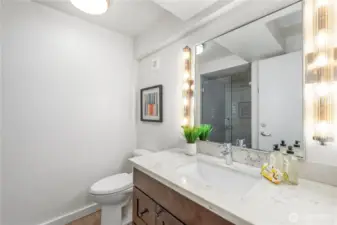 Updated tiled bathroom in ADU with modern finishes and efficient design.