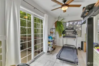 This room is located right off the dining room.  The sliding glass door leads out to a charming patio with greenhouse.