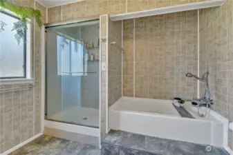 Full Bath located upstairs.  Very light and bright and features a walk in shower and soaking tub.