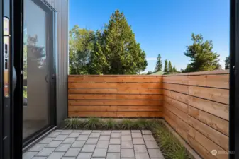 The front patio is nestled off the dining and living areas, making it the perfect spot for a grill, al fresco dining, or to relax after a long day.