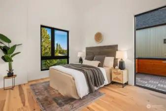 The primary bedroom boasts soaring ceilings, access to the roof deck, large windows, and an abundance of natural light, creating a tranquil and airy retreat within the home.