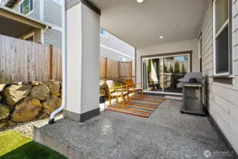 Covered patio with plenty of space for your grilling and entertaining needs!