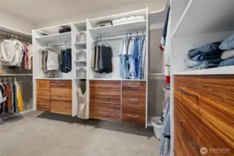 Fantastic walk-in-closet includes built ins and beautiful hand made drawers, built by the owner!