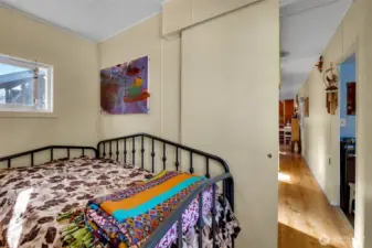 Spacious primary bedroom at south end of home